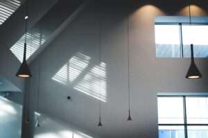Professional painter applying plaster on wall during wall plastering project in Singapore by Painting Service SG.