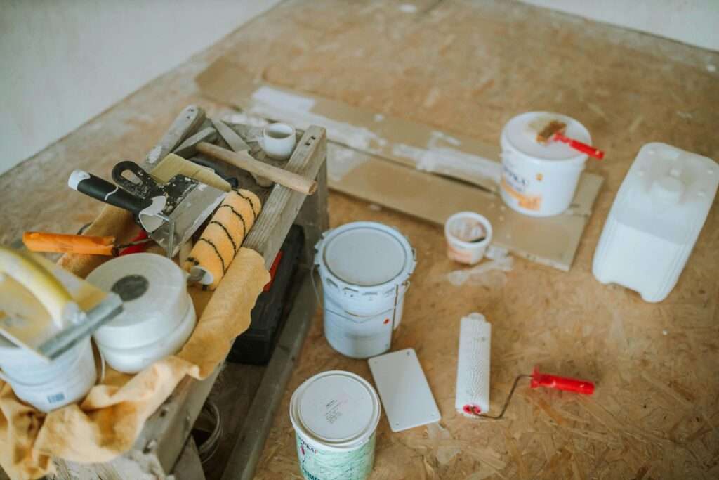 Painting Tips Singapore – Professional Painter Prepping Wall Surface for Smooth Interior Painting Finish