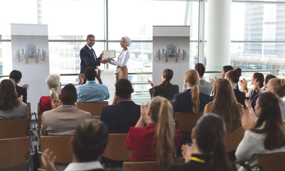businesswoman-receiving-award-from-businessman-at-business-seminar-in-office-building.jpg businesswoman-receiving-award-from-businessman-at-business-seminar-in-office-building.jpg