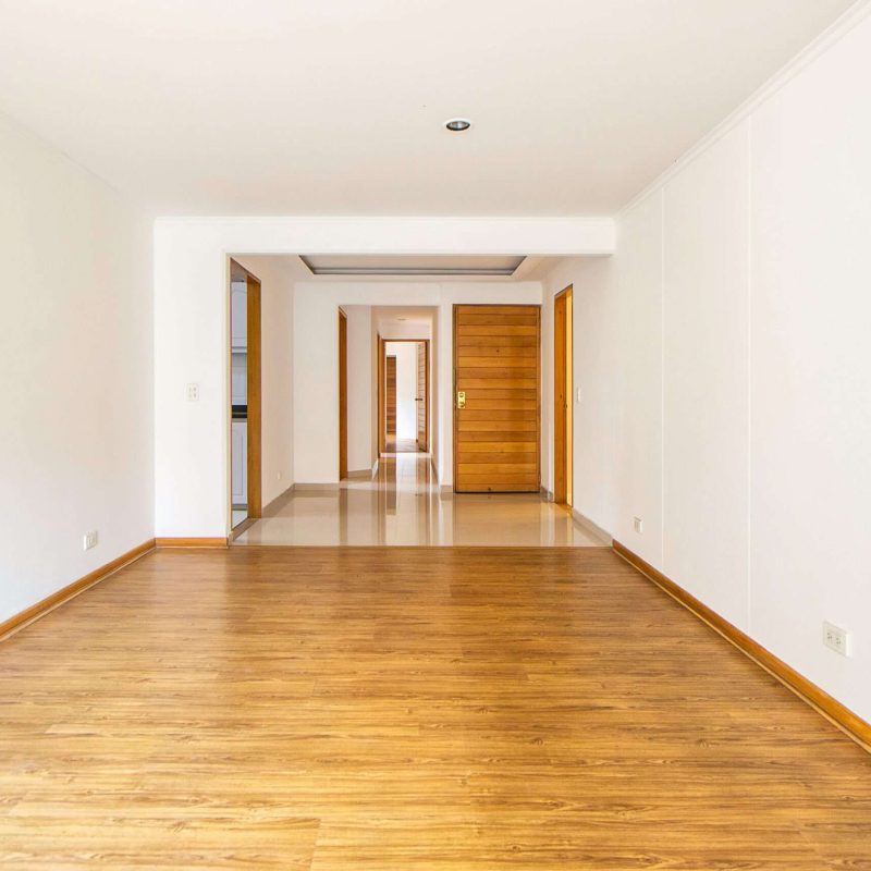 pexels-fotografiagmazg-7865621 Best Painting Services in Singapore – Professional Painter Applying Grey Paint on Wall with Roller | HDB and Condo Painting Experts