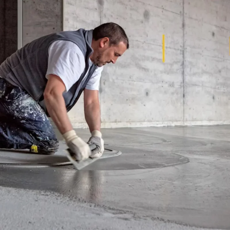 za-floor-screed a senior painter showing cement screeding